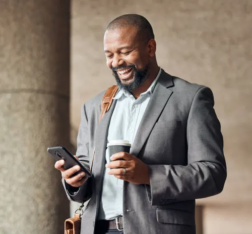 A team member reviewing work on a mobile device